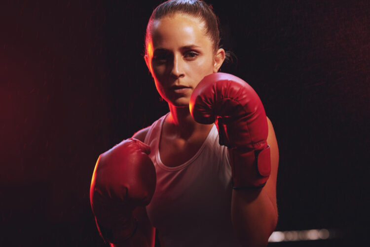 fitness boxer woman sports boxing gloves training exercise fighting be young champion fighter ring portrait energy strong girl with courage power punch motivation